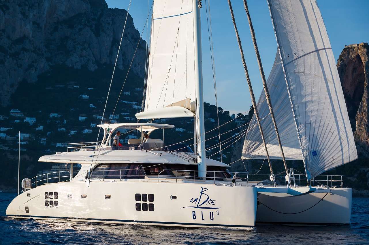 Ombre Blu3 Crewed Sunreef 70 Catamaran Charter Sailing in Italy