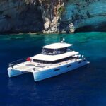 Cute Little Cat Crewed Lagoon 630 Powercat Charter Anchored in Greece