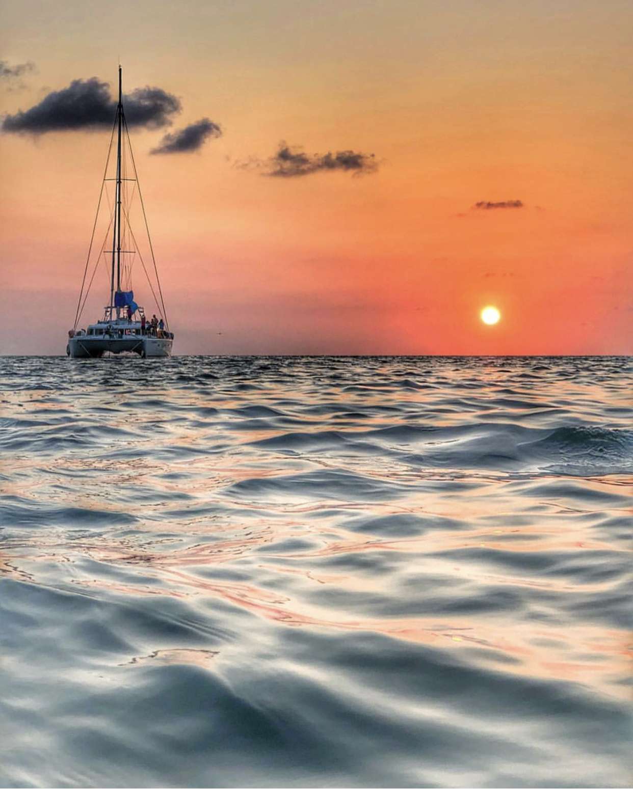Endless Options Crewed Catamaran Charter Anchored for Belizean Sunset