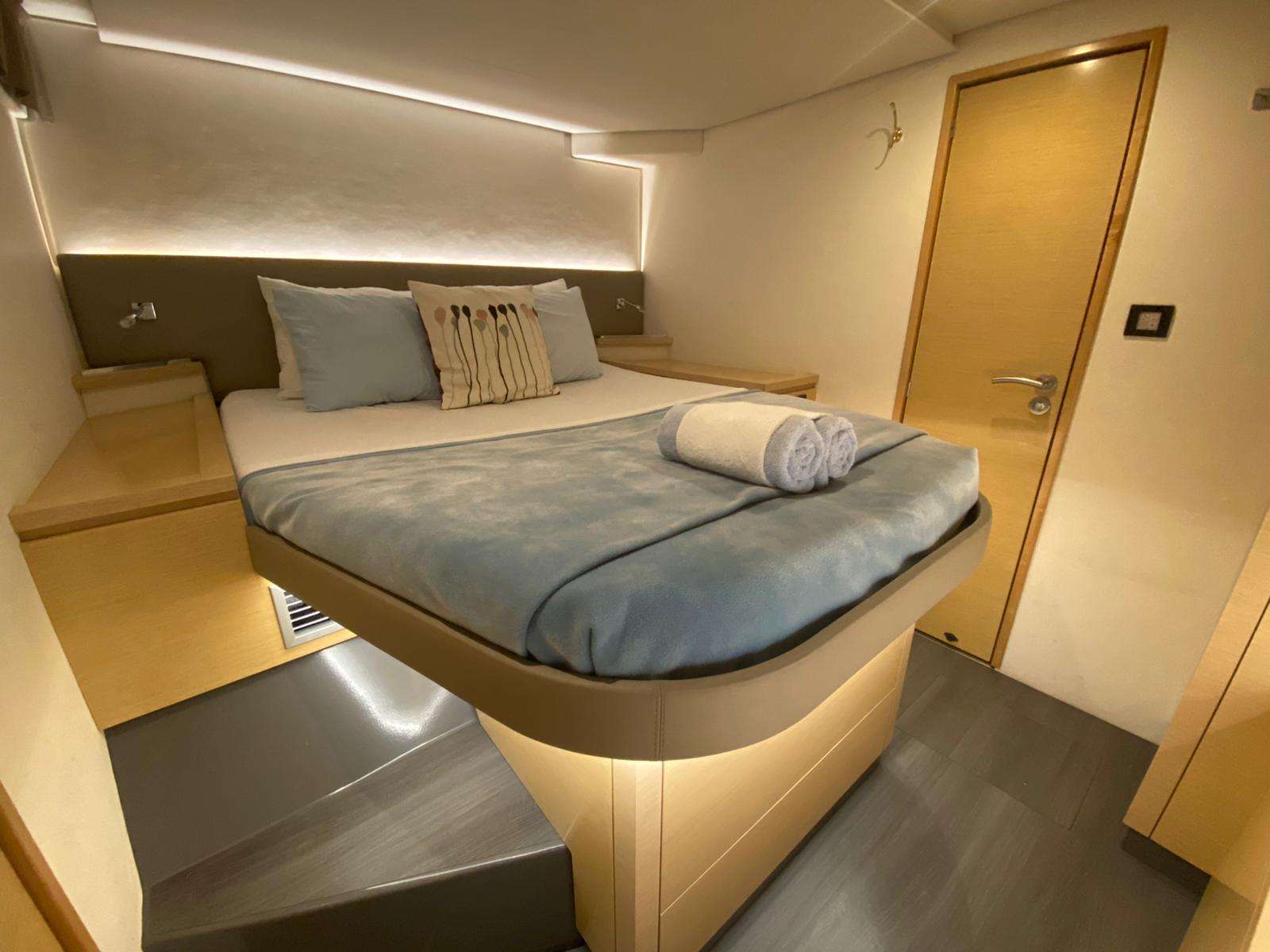 Nowhere Crewed Catamaran Charter En Suite Guest Cabin with Walkaround Queen Bed
