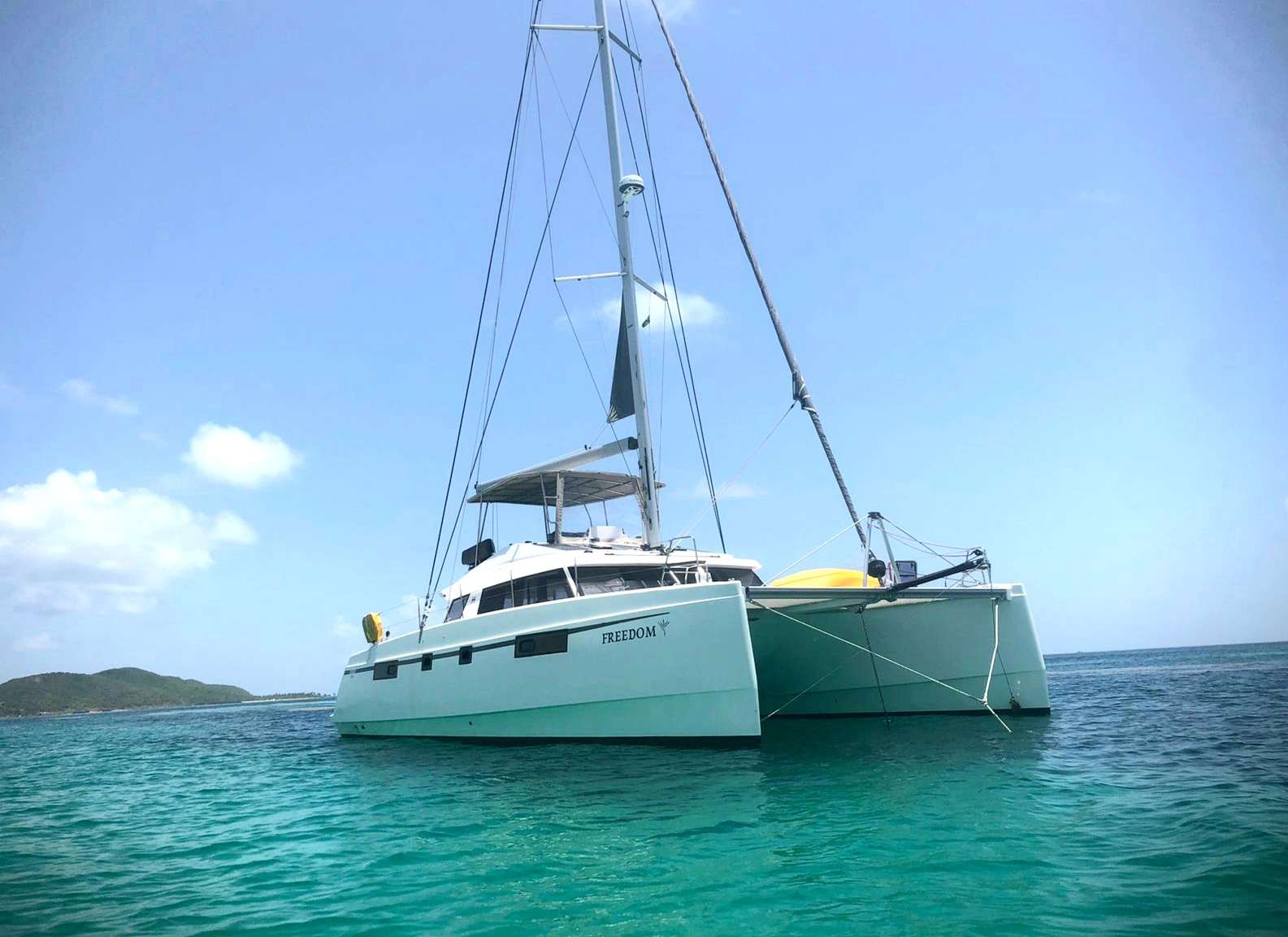 Freedom Crewed Catamaran Charter Anchored in the Grenadines