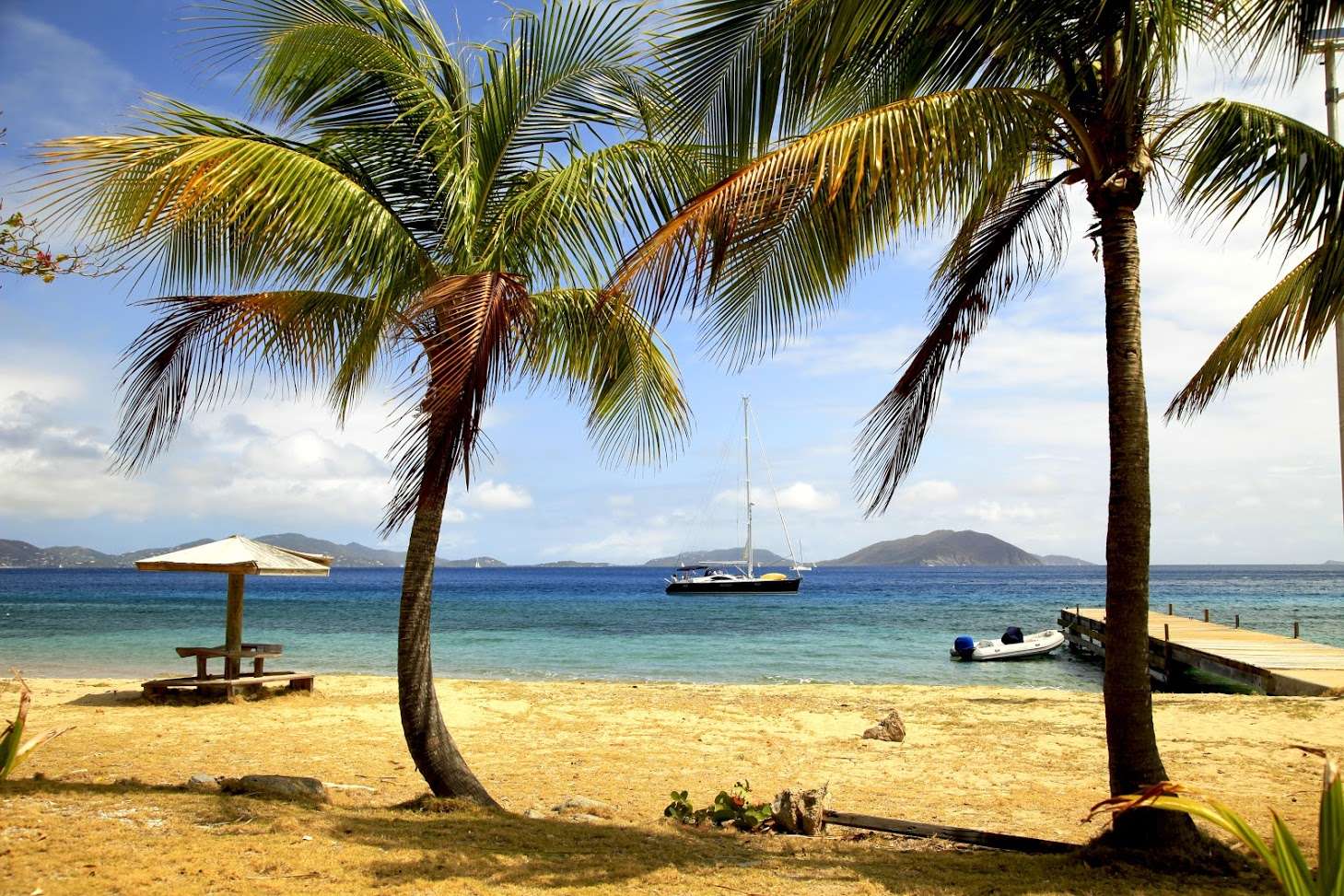 Sayang Crewed Yacht Charter Anchored off the Beach in the BVI