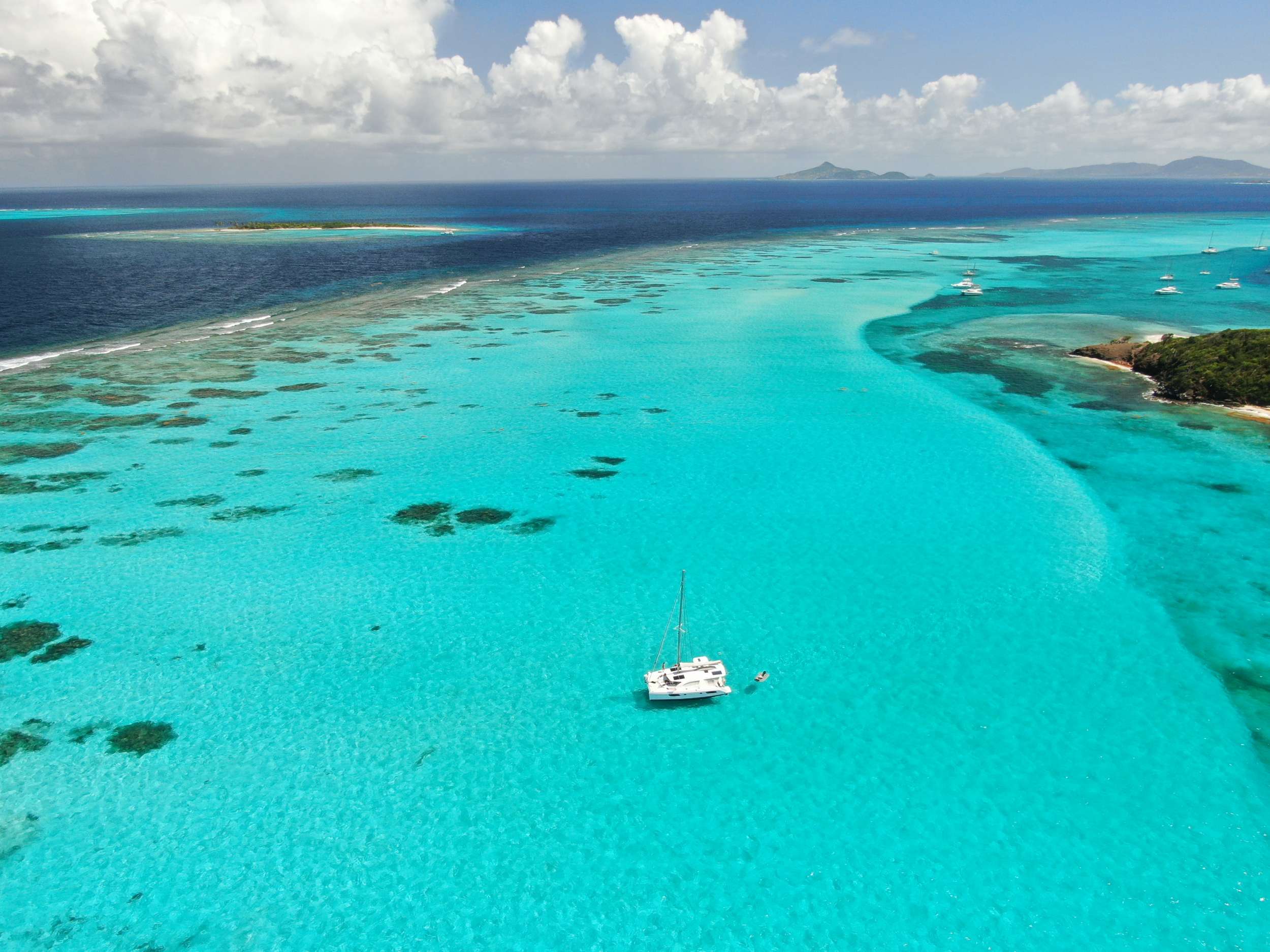 Groovy Crewed Catamaran Charter Anchored in the Tobago Cays