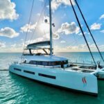 Twin Flame Crewed Lagoon Seventy 7 Catamaran Charters Anchored in the BVI