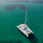 Stadium Crewed Catana Catamaran Charter Anchored in Greece