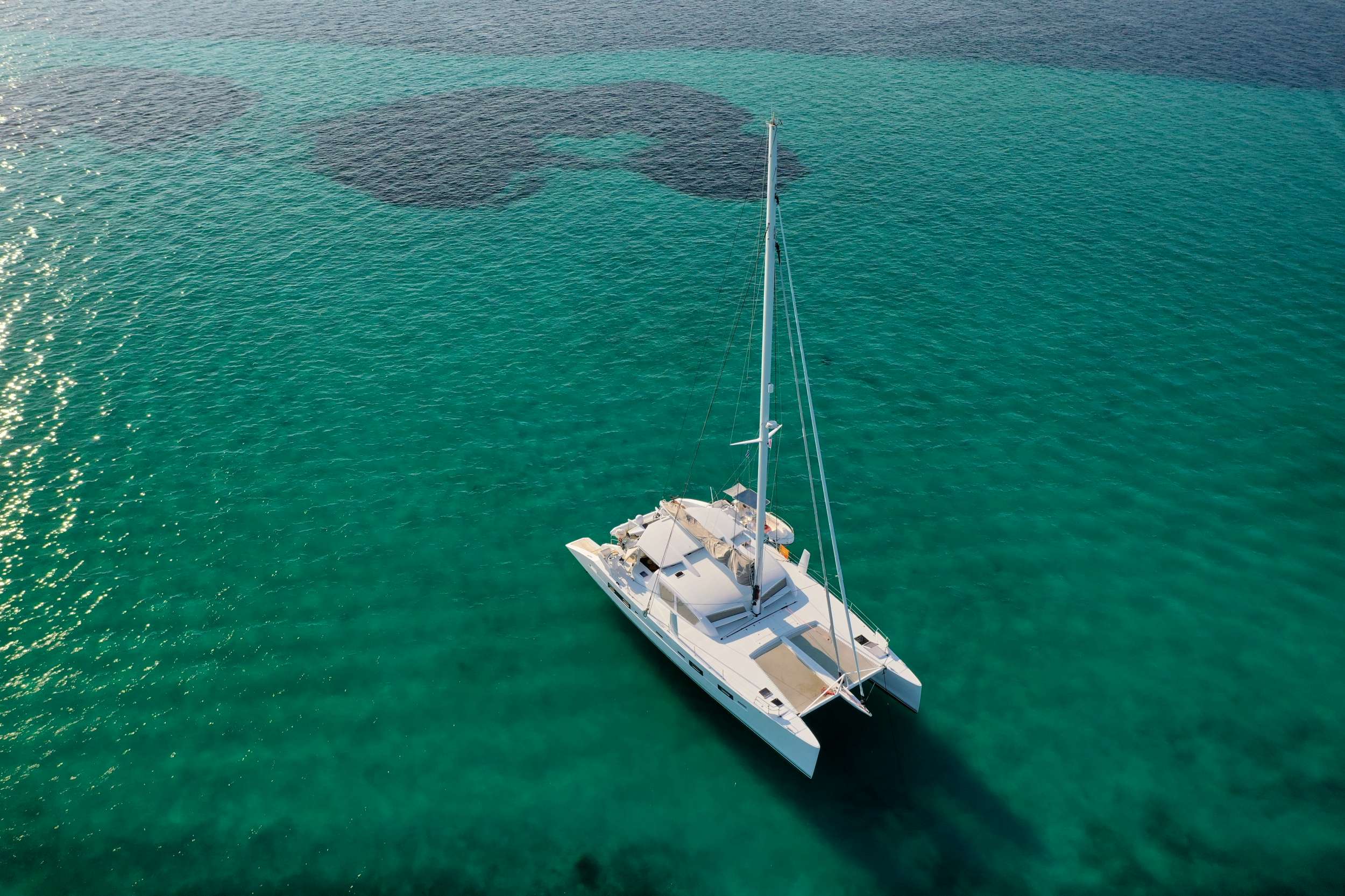 Stadium Crewed Catana Catamaran Charter Anchored in Greece