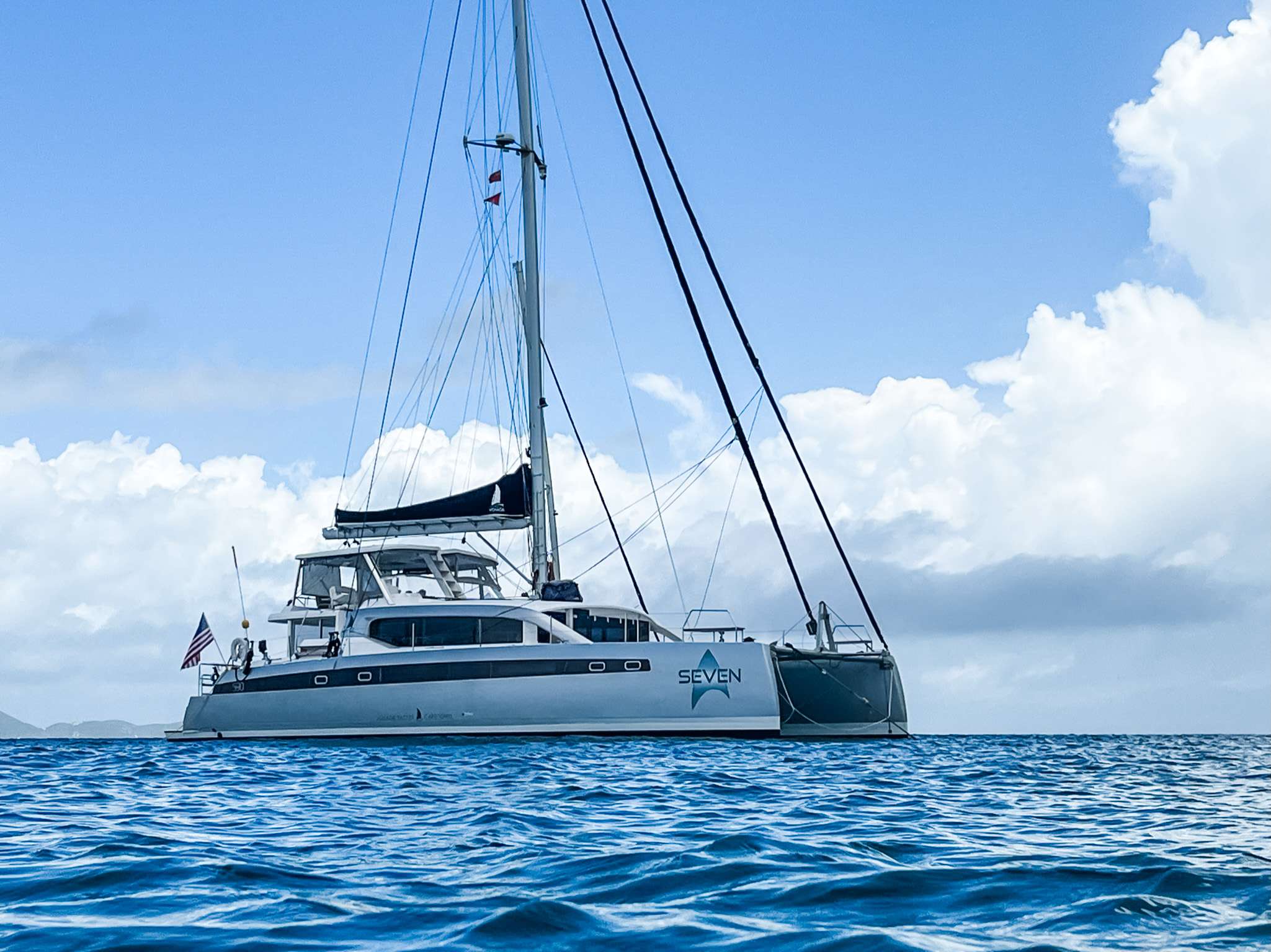 Seven Crewed Voyage 590 Catamaran Charters for 10 guests Sailing the BVI.