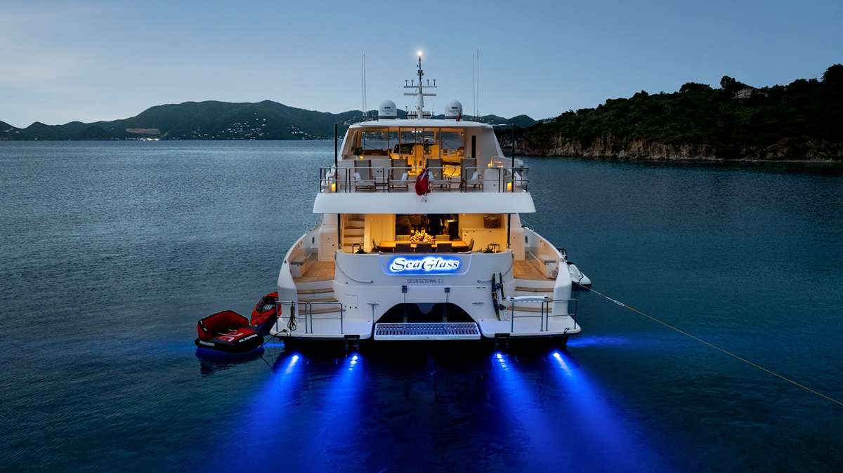 Luxury Crewed Power Catamaran Seaglass 74 Stern at night