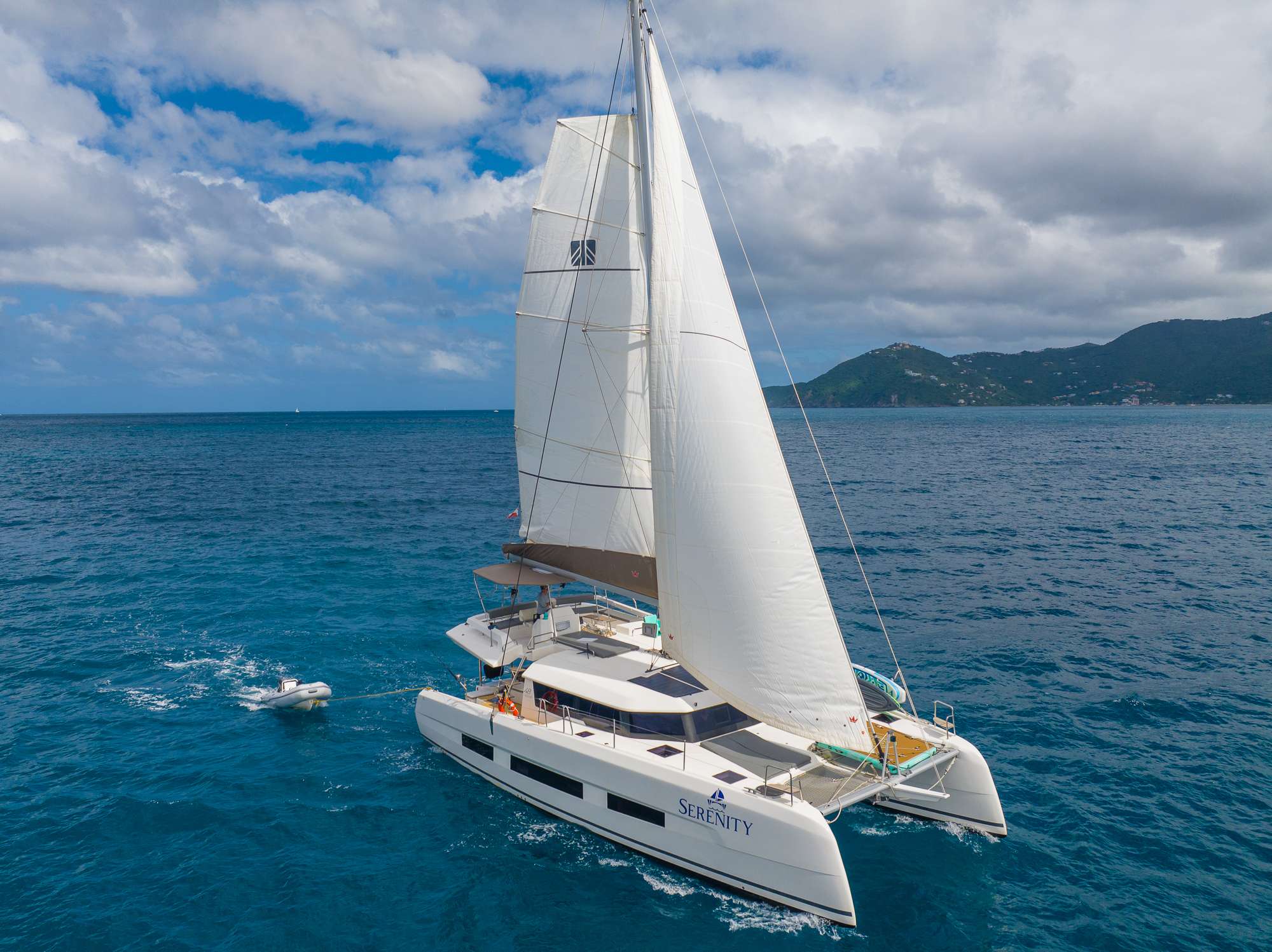Serenity 48 Crewed Dufour Catamaran Charter Sailing the BVI.
