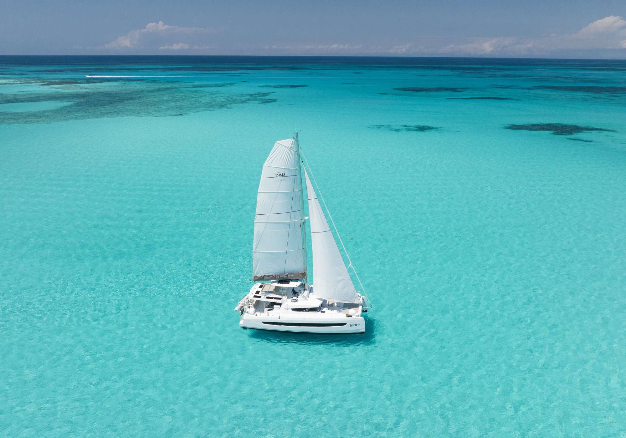 Drift Crewed Bali 5.4 Catamaran Charters Sailing the Exumas.